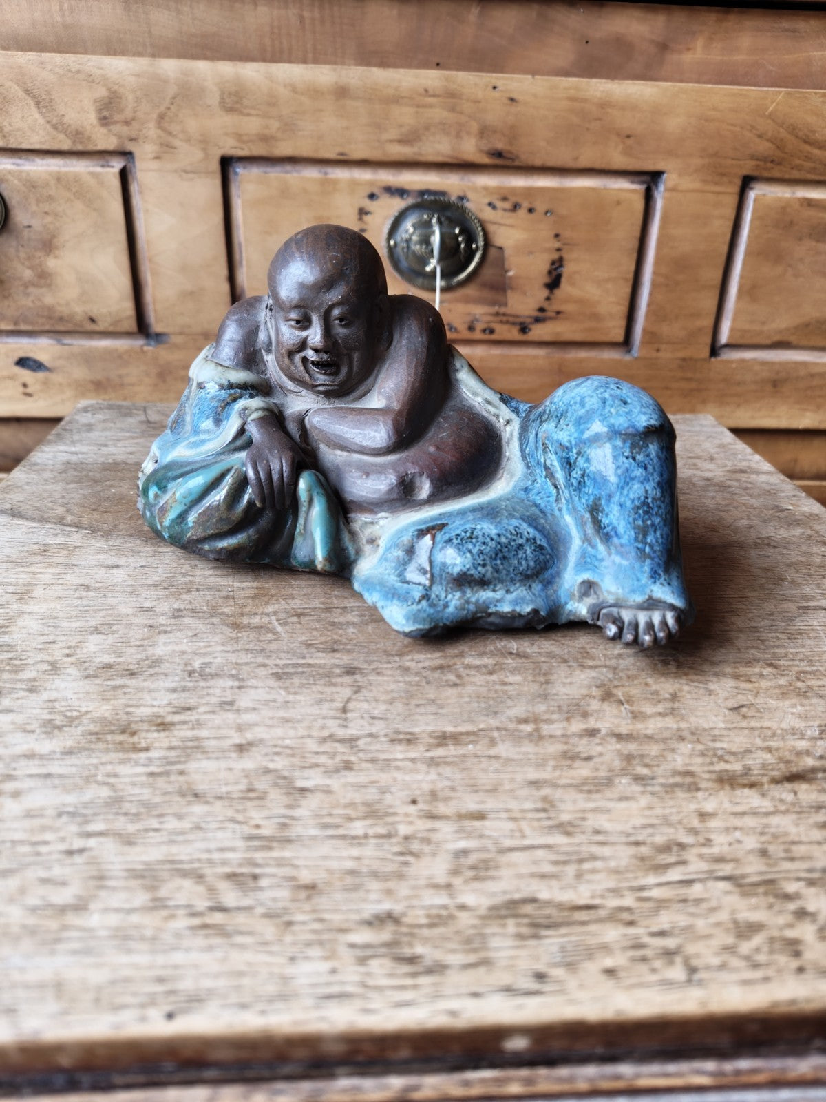 Laughing Buddha in Terracotta, Partially Blue Glazed