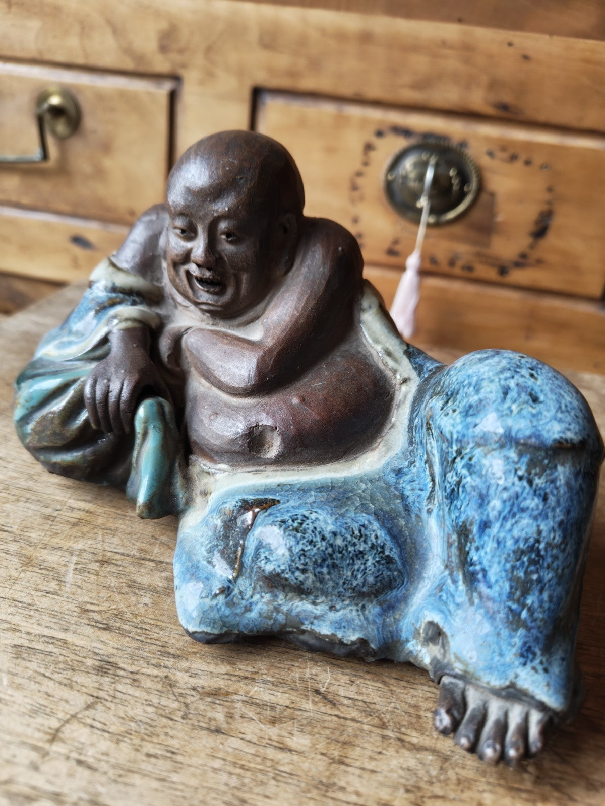 Laughing Buddha in Terracotta, Partially Blue Glazed