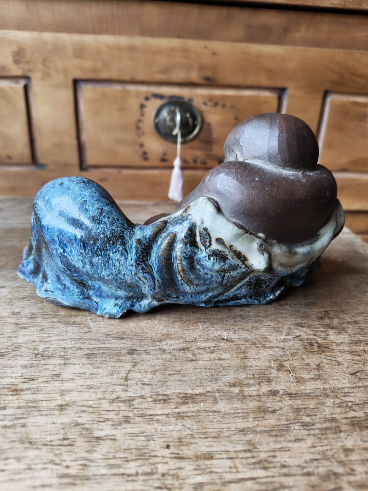 Laughing Buddha in Terracotta, Partially Blue Glazed
