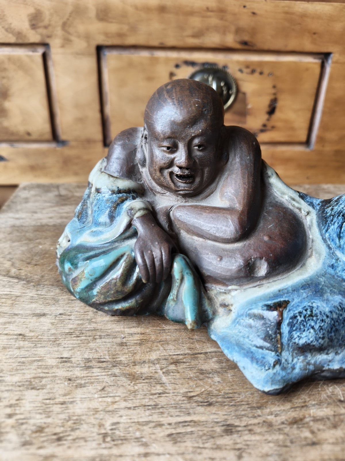 Laughing Buddha in Terracotta, Partially Blue Glazed