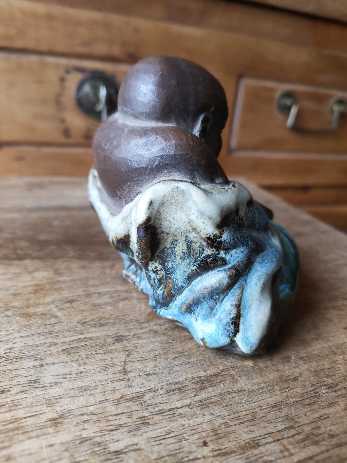 Laughing Buddha in Terracotta, Partially Blue Glazed