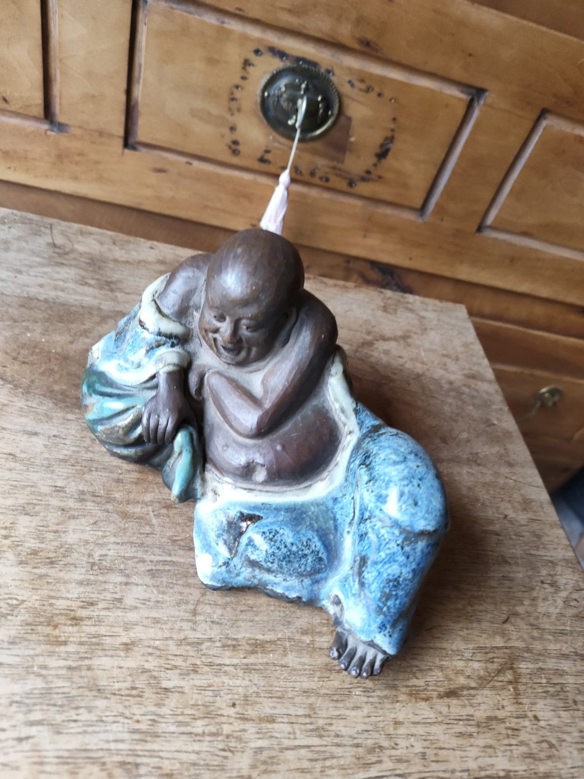 Laughing Buddha in Terracotta, Partially Blue Glazed